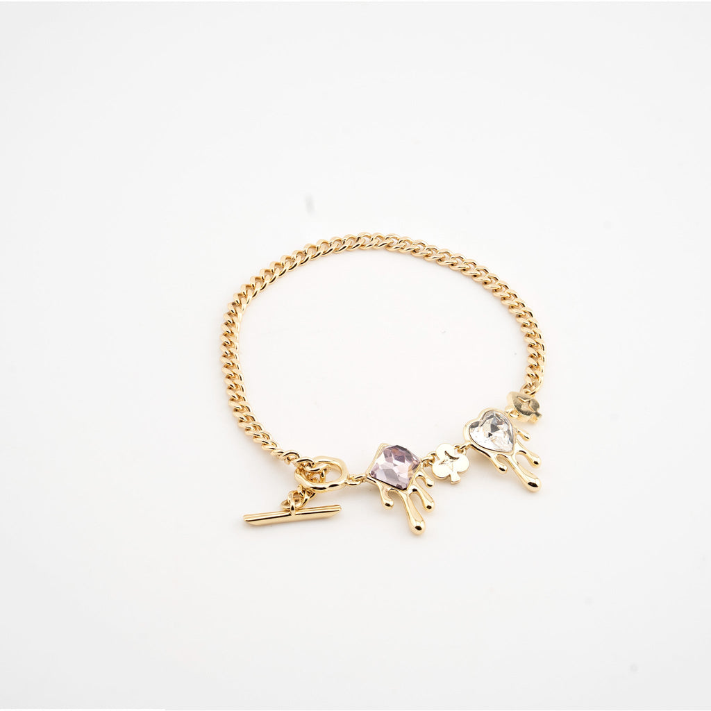 Pulsera dorada con cristales rosa y blanco