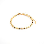 Pulsera en acero inoxidable con baño de oro con esferas