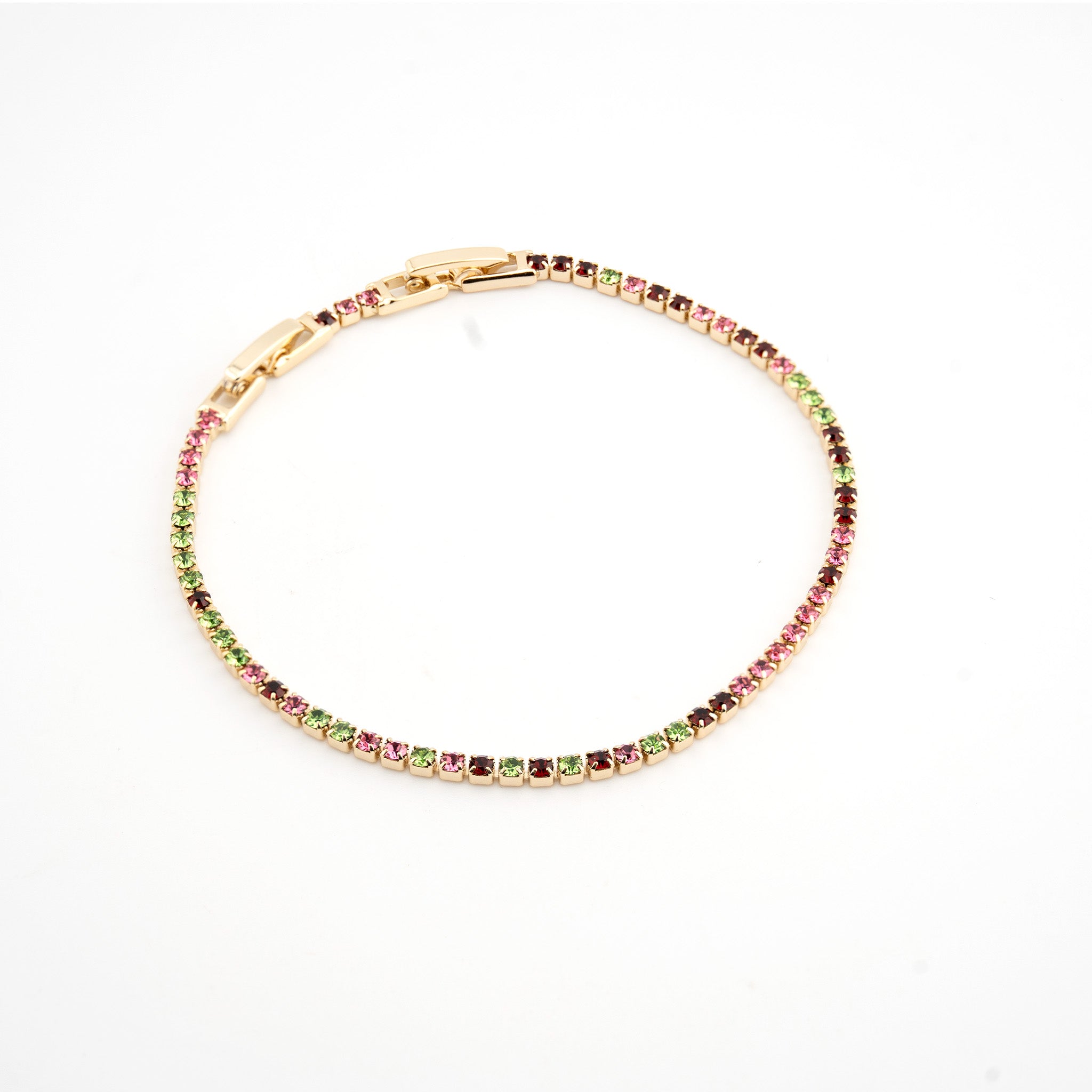 Pulsera dorada con cristales de colores