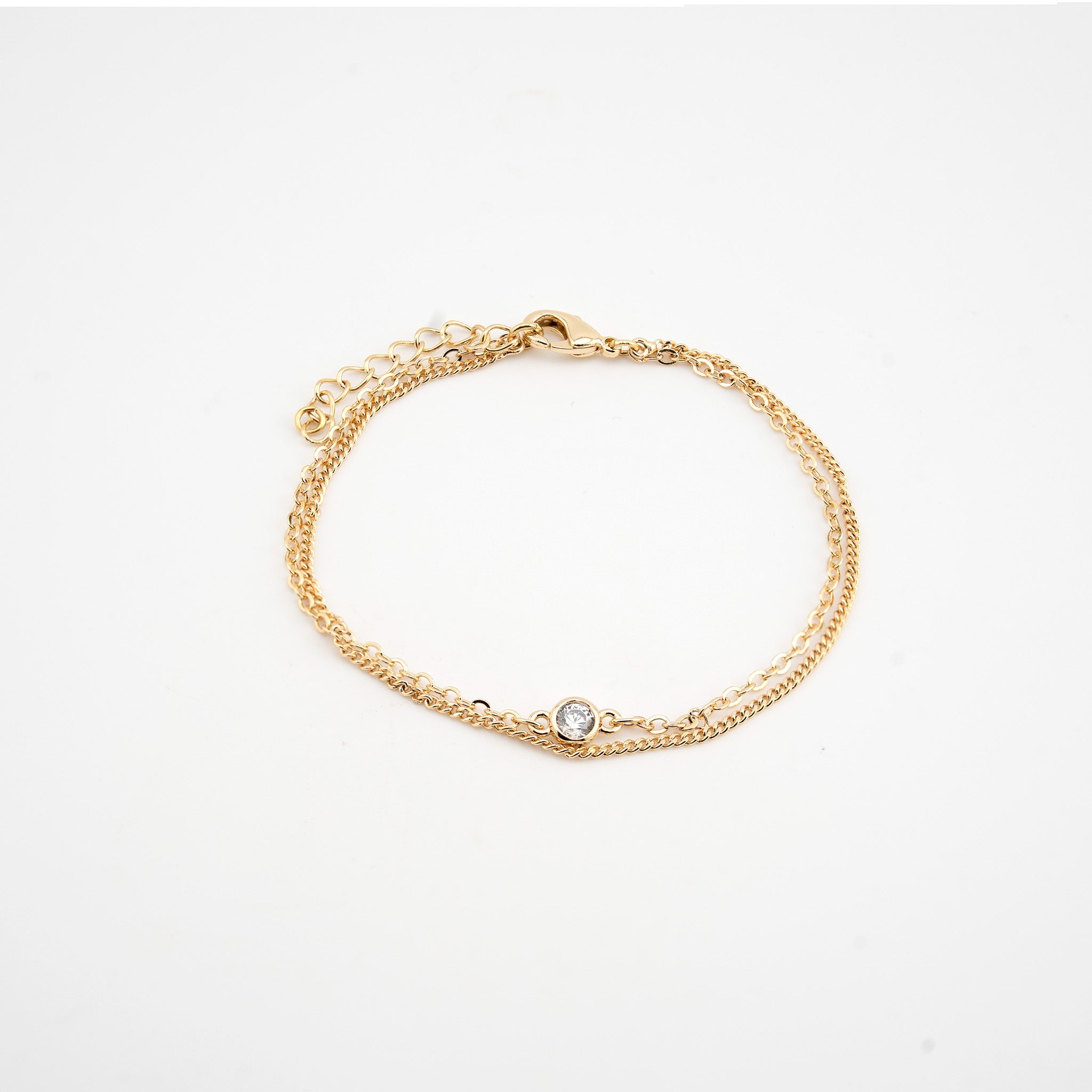 Pulsera dorada con doble cadena y un cristal